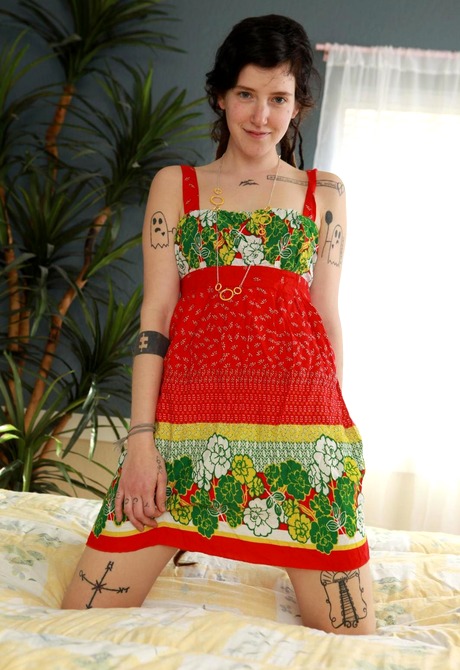 Little tattooed Wynd pleasures her bushy hole with a dildo