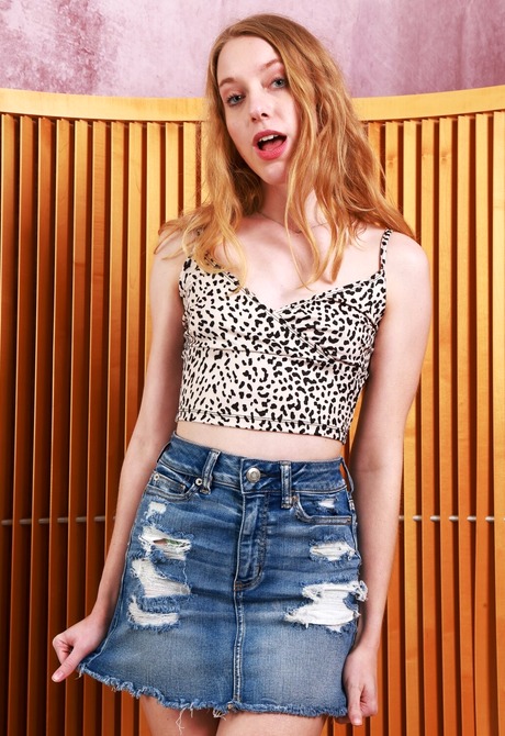 Cute unshaved teen Kallie Taylor teasing in jean skirt and panties