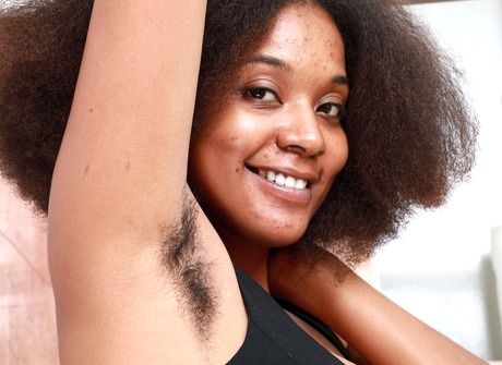 Ebony with big saggy tits spreads her hairy pussy in the shower - 4 of 16