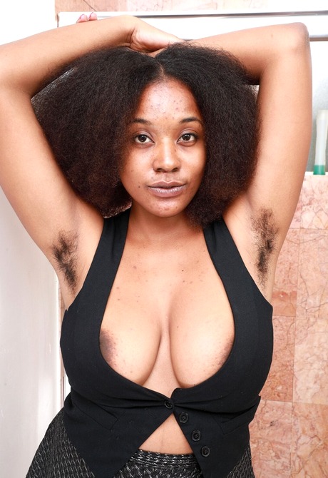 Ebony with big saggy tits spreads her hairy pussy in the shower - 5 of 16