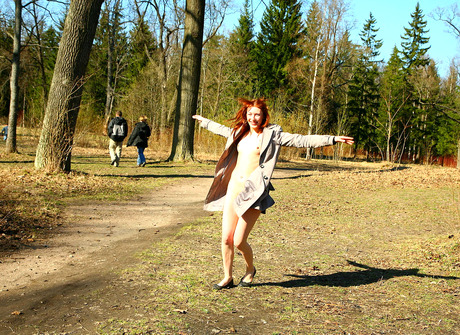 Redhead amateur Passion showing furry pussy outdoors