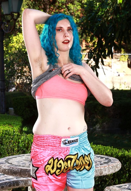 Hairy amateur girl Lux Lives stripping and teasing naked outdoors - 4 of 16