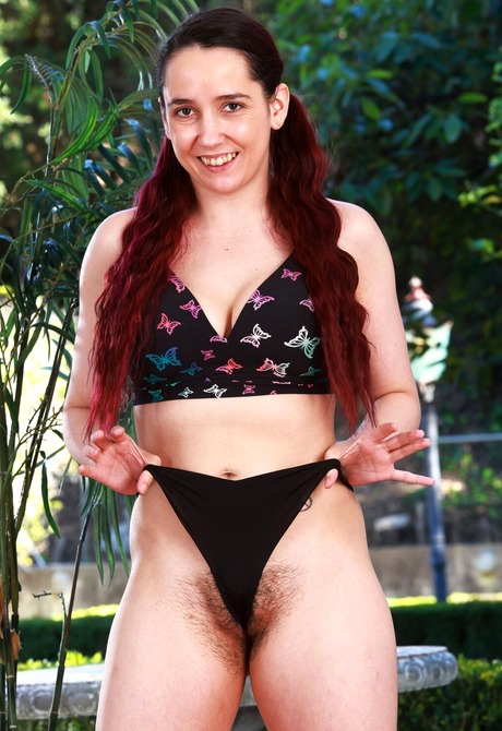 Hairy natural amateur peeling off jean skirt outdoors