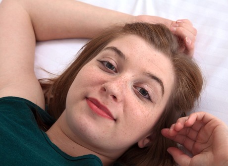 Chubby hairy teen Kady spreading unshaved muff in bed