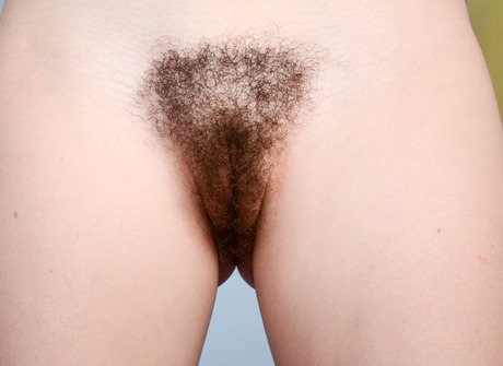 Redhead amateur Emma Evins spreading her hairy pink pussy - 14 of 16