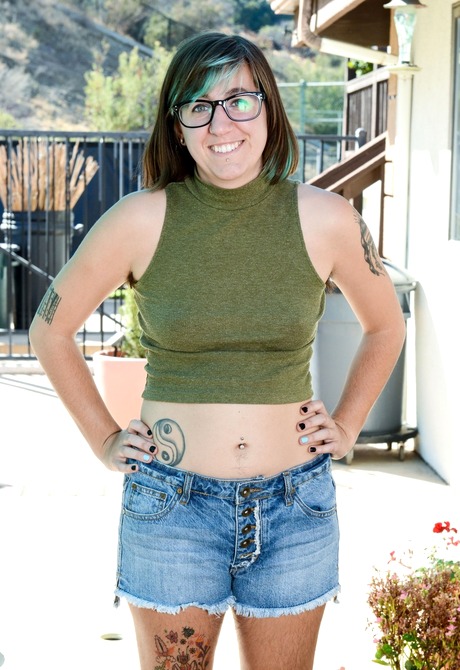 Nerdy brunette Anika flaunts her hairy pits legs and snatch