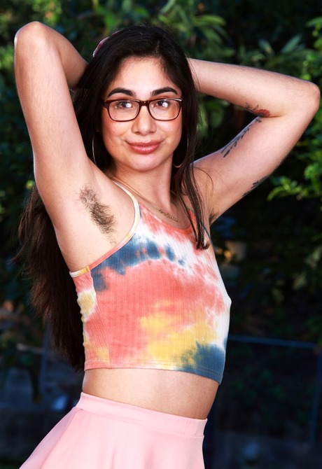 Natural latina Lucy Sunflower undressing outdoors and flaunting hirsute body