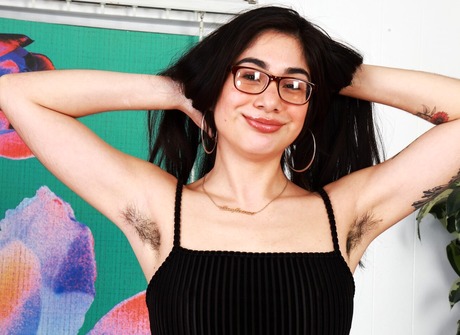 Lucy Sunflower taking off dress and flaunting hairy pussy wearing glasses