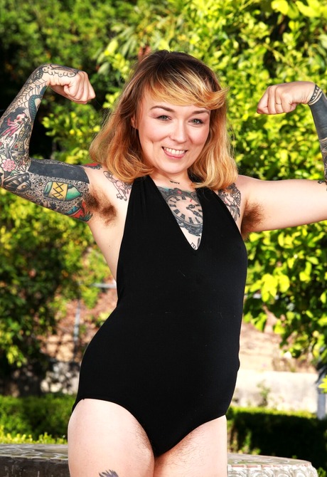 Tattooed hairy amateur Felicia Fisher spreading unshaved pussy
