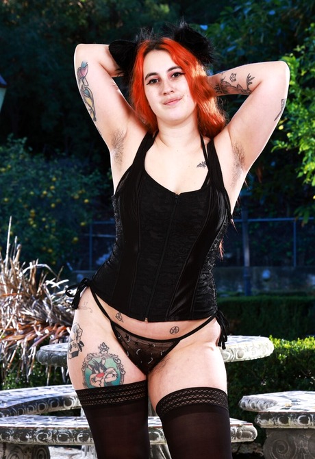 Curvy big assed redhead Gigi undressing and spreading hairy pussy - 2 of 16