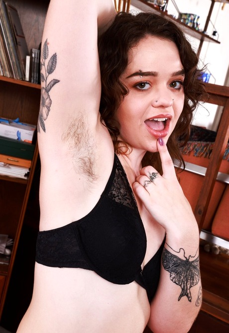 Brunette with nice ass and navel piercing Stacey Barnes reveals hairy pussy
