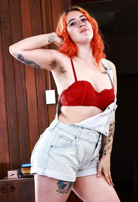 Chubby redhead Gigi teases with big nice ass before spreading hairy pussy - 2 of 16