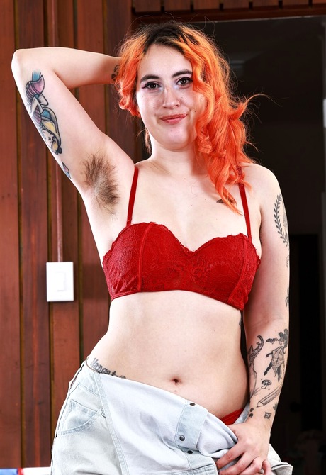 Chubby redhead Gigi teases with big nice ass before spreading hairy pussy - 4 of 16