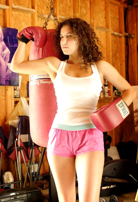 Boxer babe Sativa Verte removes shorts to flash hairy pussy along with big tits - 2 of 16