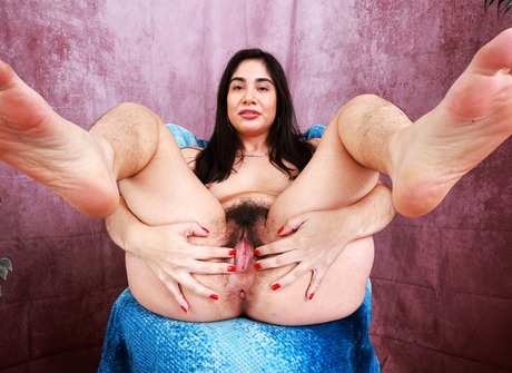 Lucy Sunflower gets naked and spreads her hairy pussy - 12 of 16