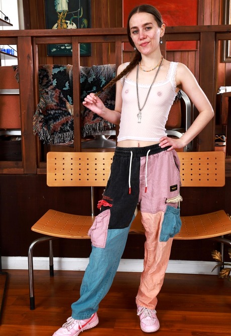 Cute babe Sia Wood strips work clothes and reveals hairy pussy for closeup - 6 of 16