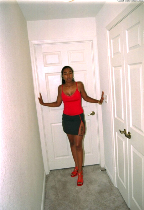 Michelle takes of her dress and red panties showing pink pussy