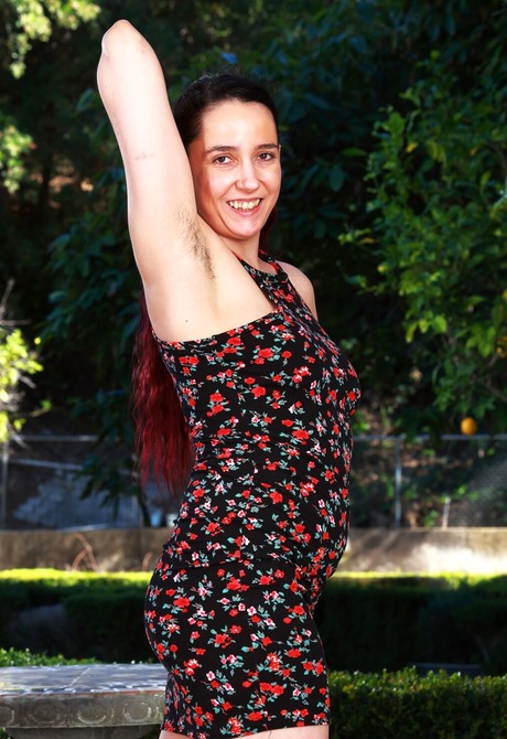 Happy natural amateur getting undressed and sharing hairy pussy