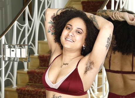 Let the curly brunette Kingsley seduce you with hairy pussy and tattoos during toy solo