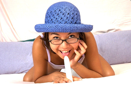 Hairy Asian with tan lines Jennifer wears blue hat while masturbating with sex toy