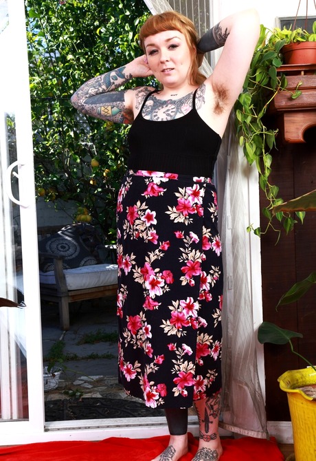 Tattooed redhead Felicia Fisher teases with hairy armpits and nice ass after stripping - 2 of 16